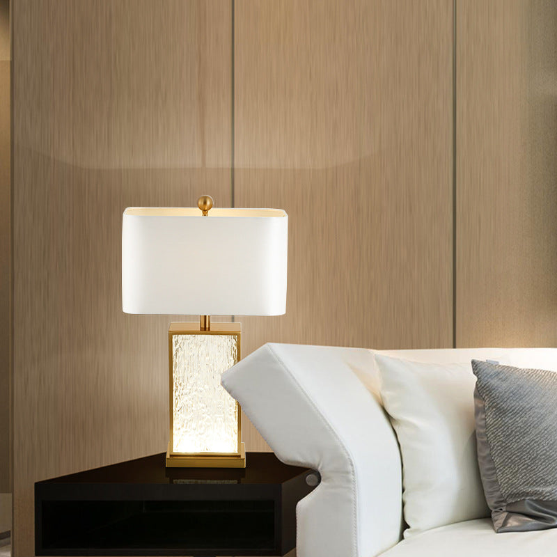 Brass table lamp on side table in living room setting