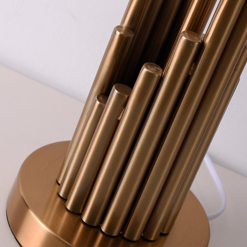 Detail view of clustered brass vertical rod base
