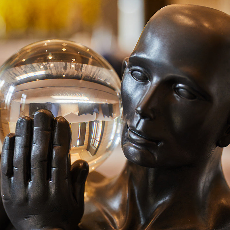 Close up detail of crystal sphere and bronze finish face