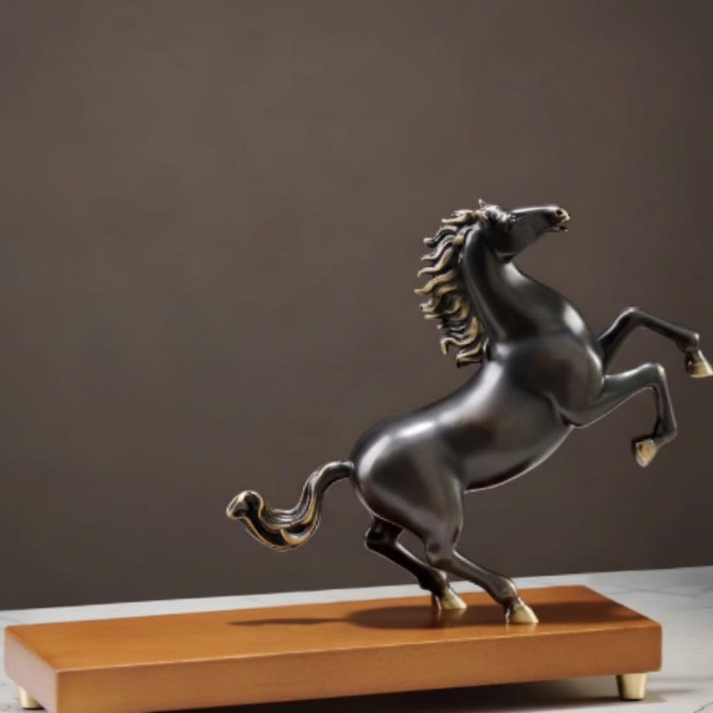 Detail view of rearing horse statue with gold accents