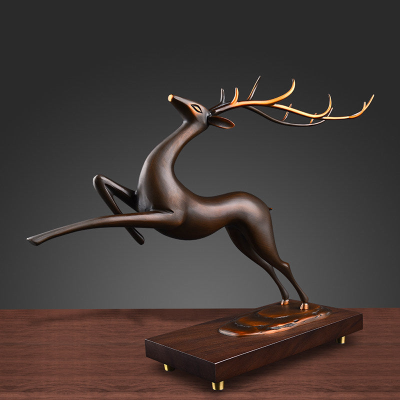 Full view of leaping stag sculpture on wooden base