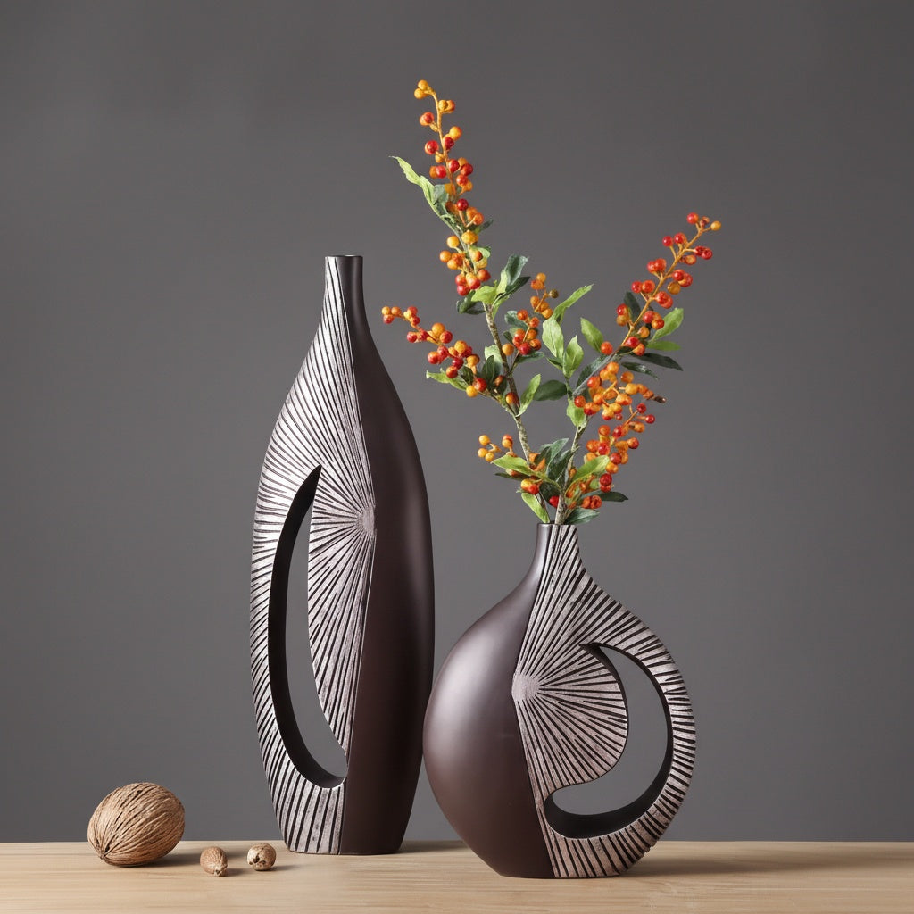 Bronze finish resin vase with abstract cutout and radial texture