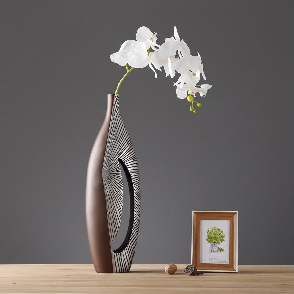 Tall bronze resin vase with white orchid styling