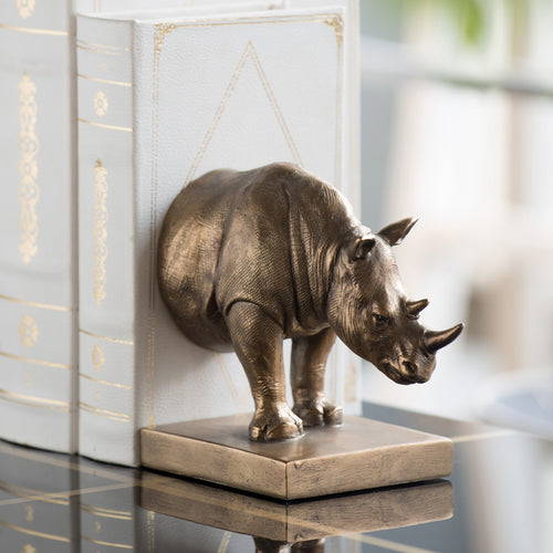 Angled view of resin rhino bookends on table