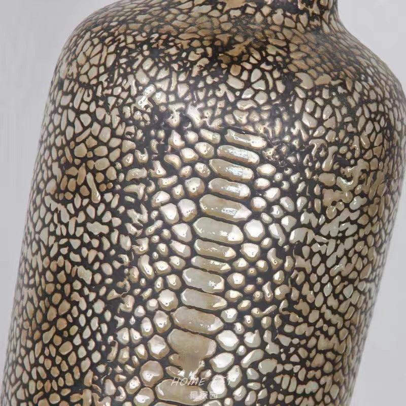 Close up detail of bronze reptile scale texture on ceramic