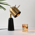 Angled view of brass and black antler table lamp