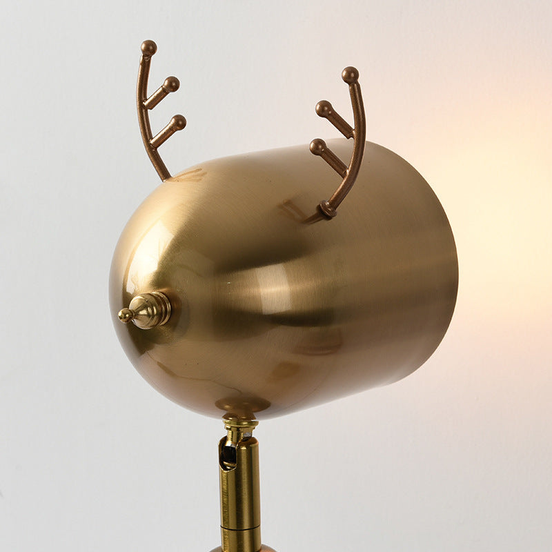 Close up detail of brass shade with antler accents