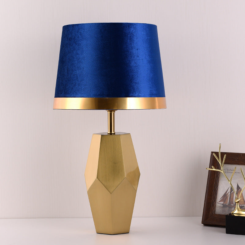 Lamp unlit showing geometric brass base