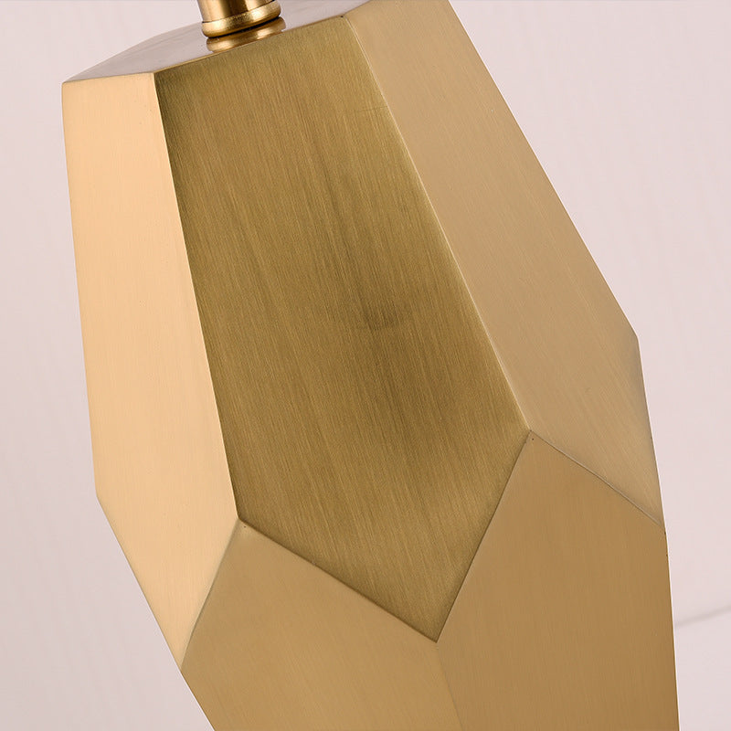 Close up detail of faceted brass metal texture