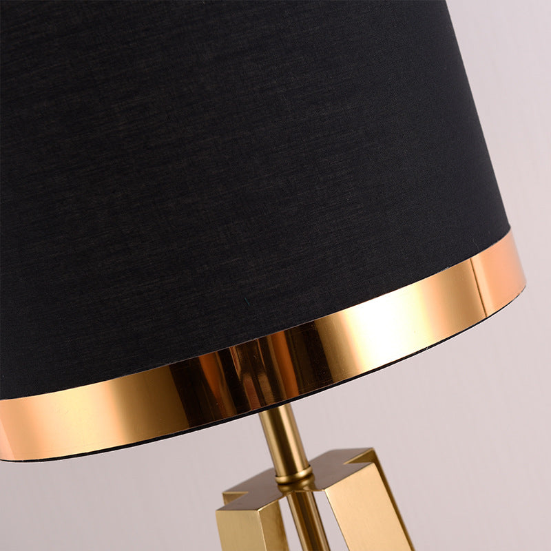 Detail of gold rim on black lamp shade