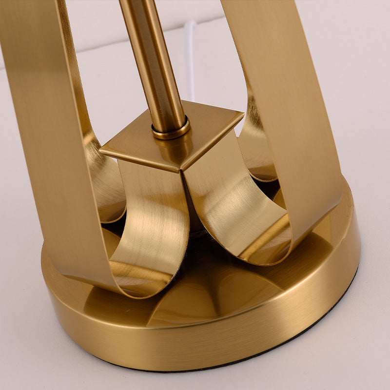 Close up of curved brass base structure