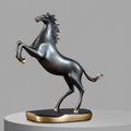 Side view of rearing horse sculpture in brushed bronze finish with gold accents