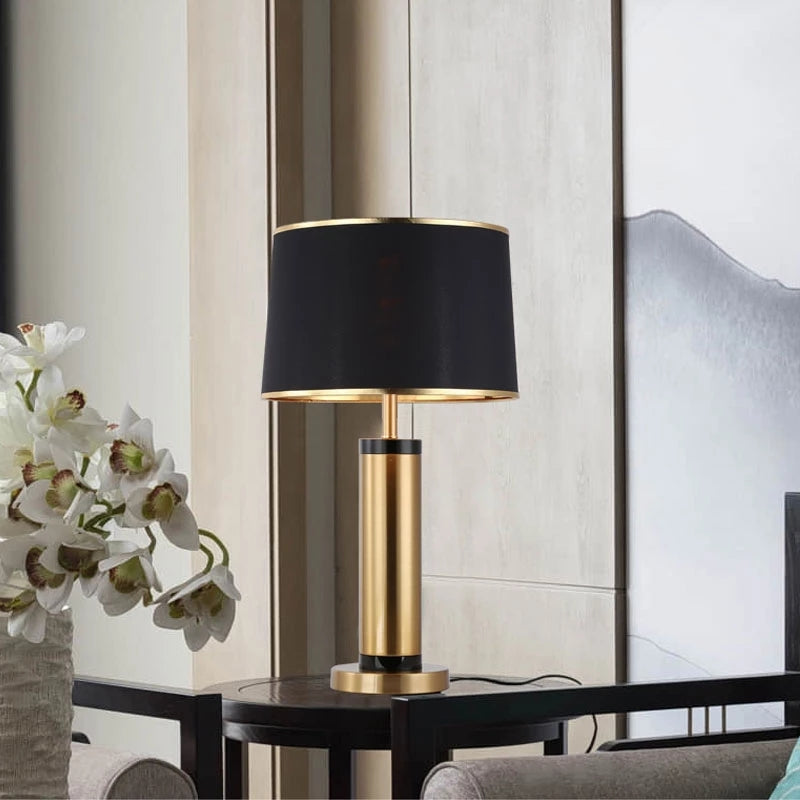 Luxury gold table lamp with black shade on side table