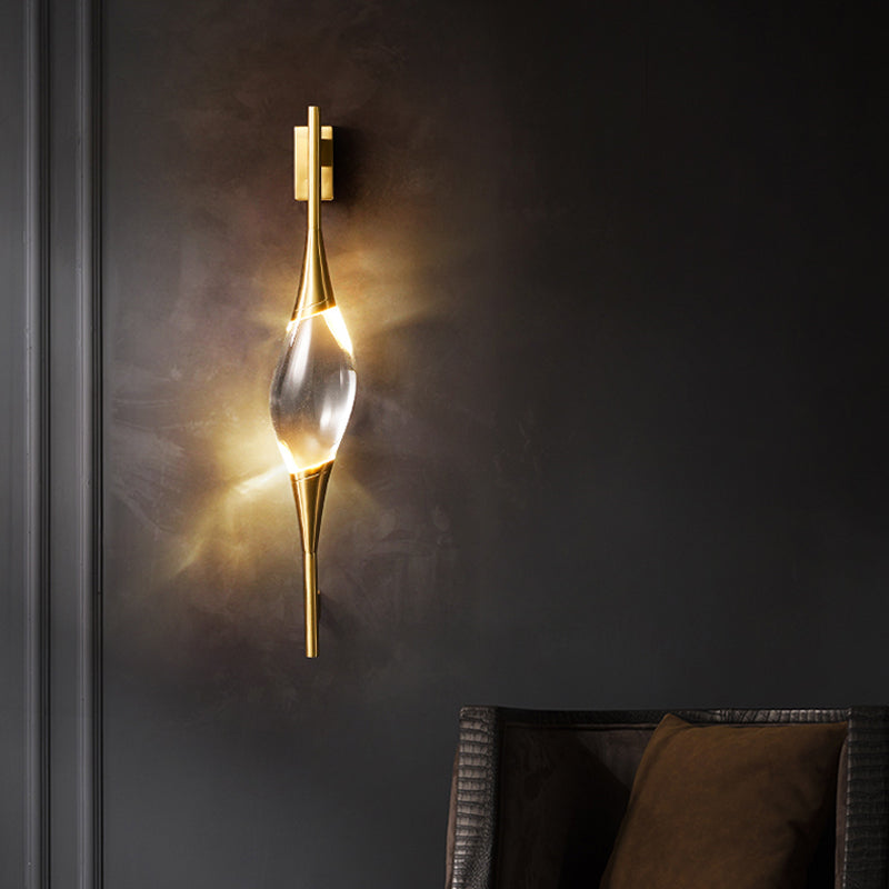 Front view of the illuminated wall sconce on a dark background