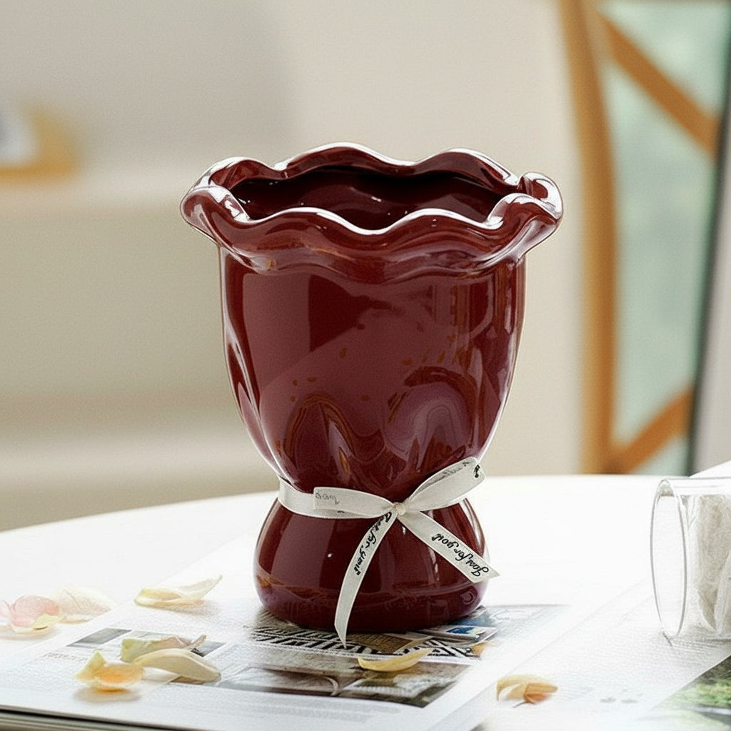 Burgundy glossy ceramic vase with ruffled rim and cinched neck