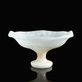 White translucent stone footed bowl on black background