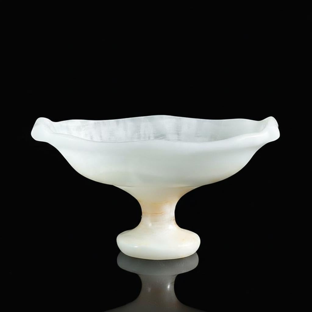 White translucent stone footed bowl on black background
