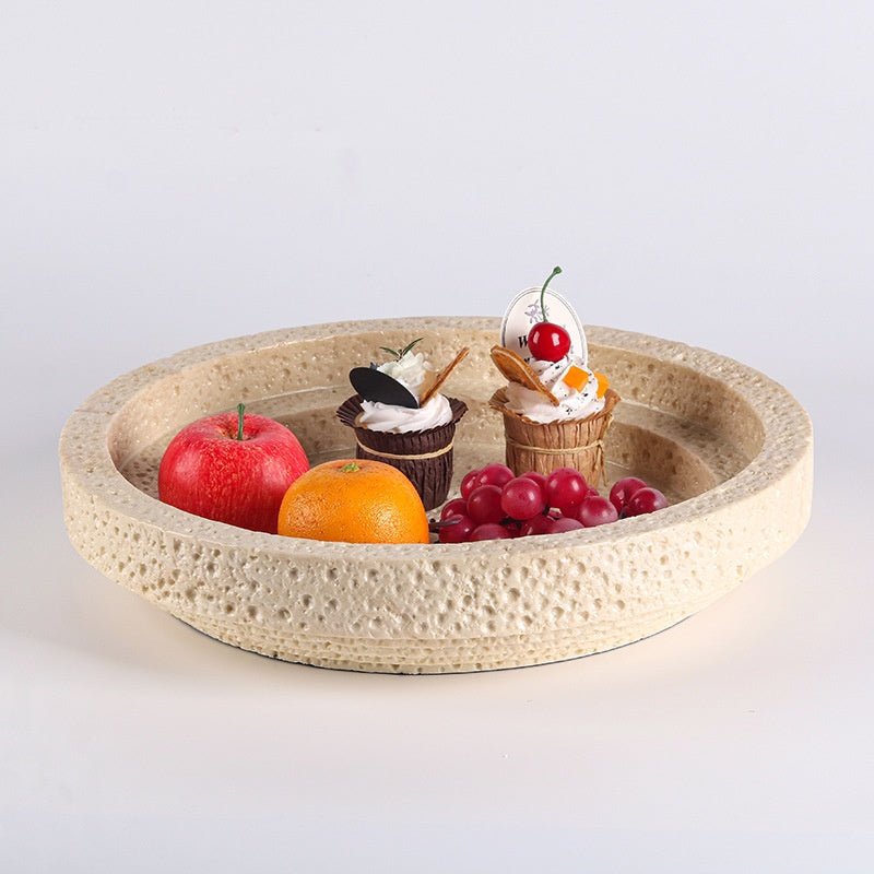 Minimalist cave stone tray with pastries