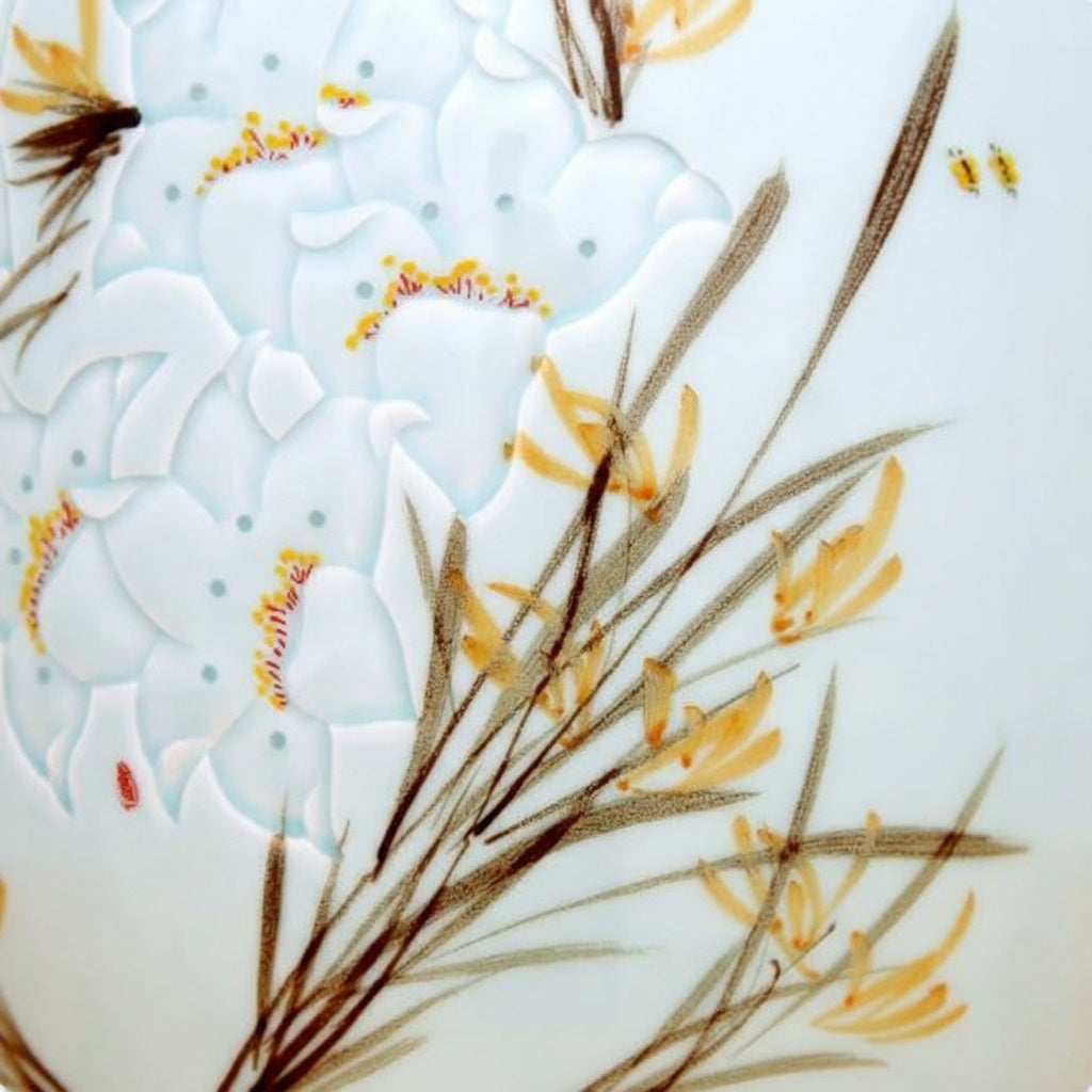 Close up detail of raised white flower carving and painted reeds