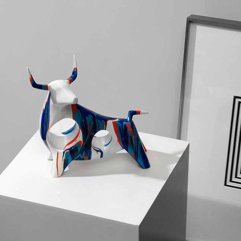 Angled view of glossy ceramic bull figurine in modern art style
