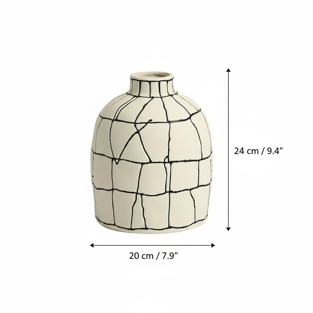 Close up of tall cylindrical ceramic vase with hand painted grid