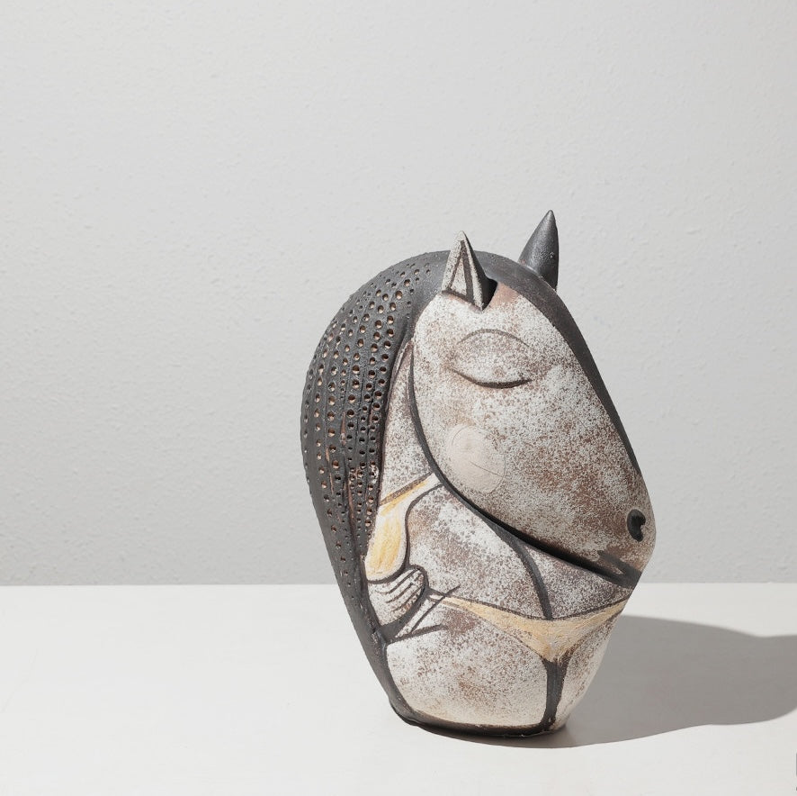 Close up detail of medium ceramic horse head sculpture with abstract design