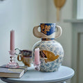 Lifestyle setting with vase and candles