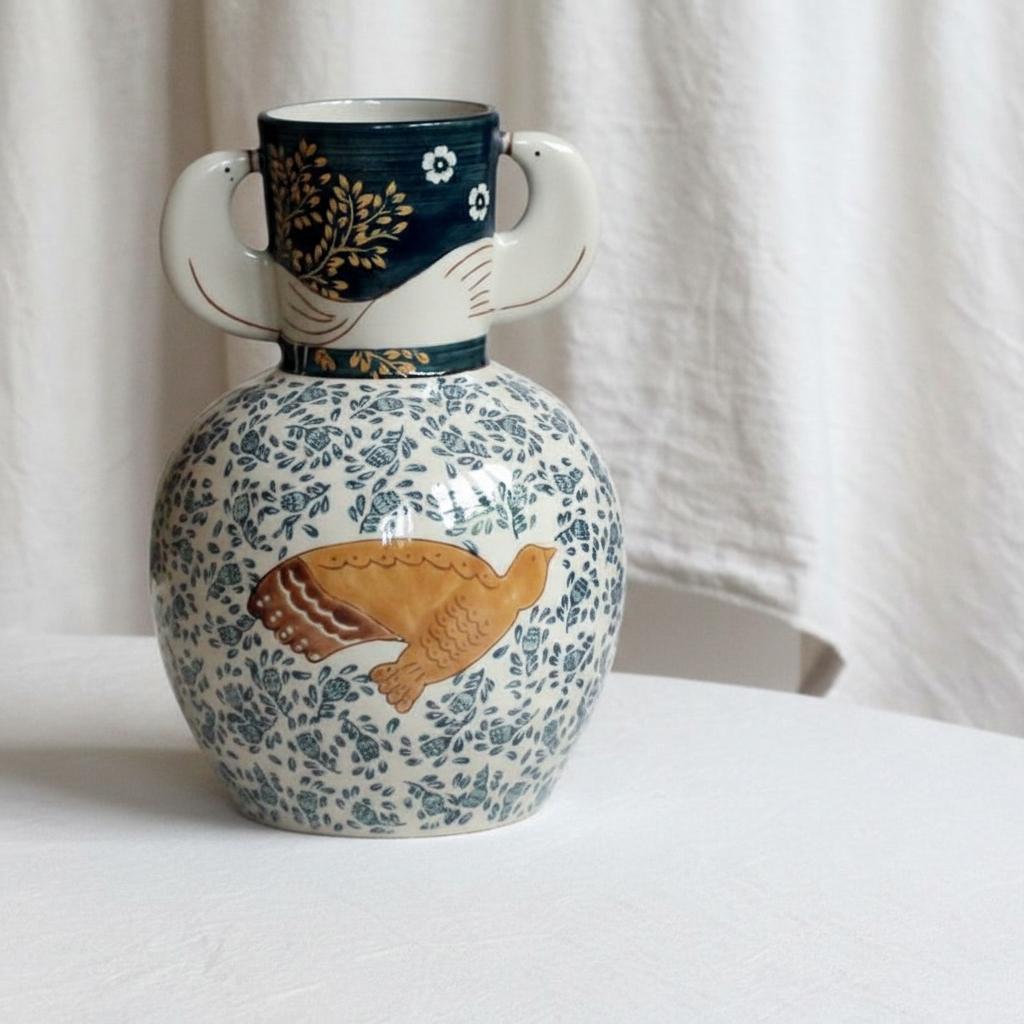 Front view of ceramic bird motif vase