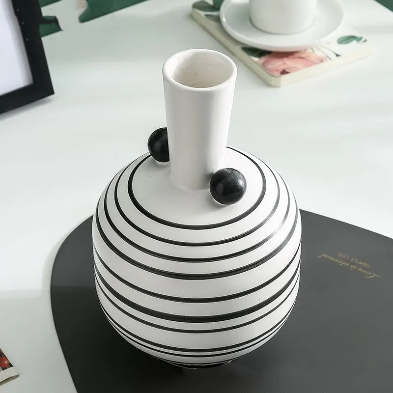 Top detail view of white striped spherical vase