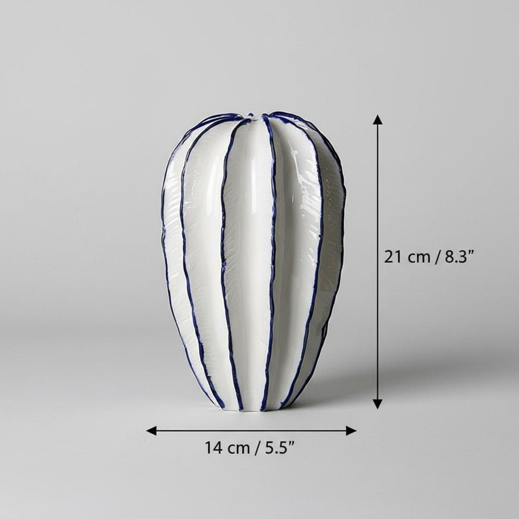Tall white ceramic ribbed vase with blue trim