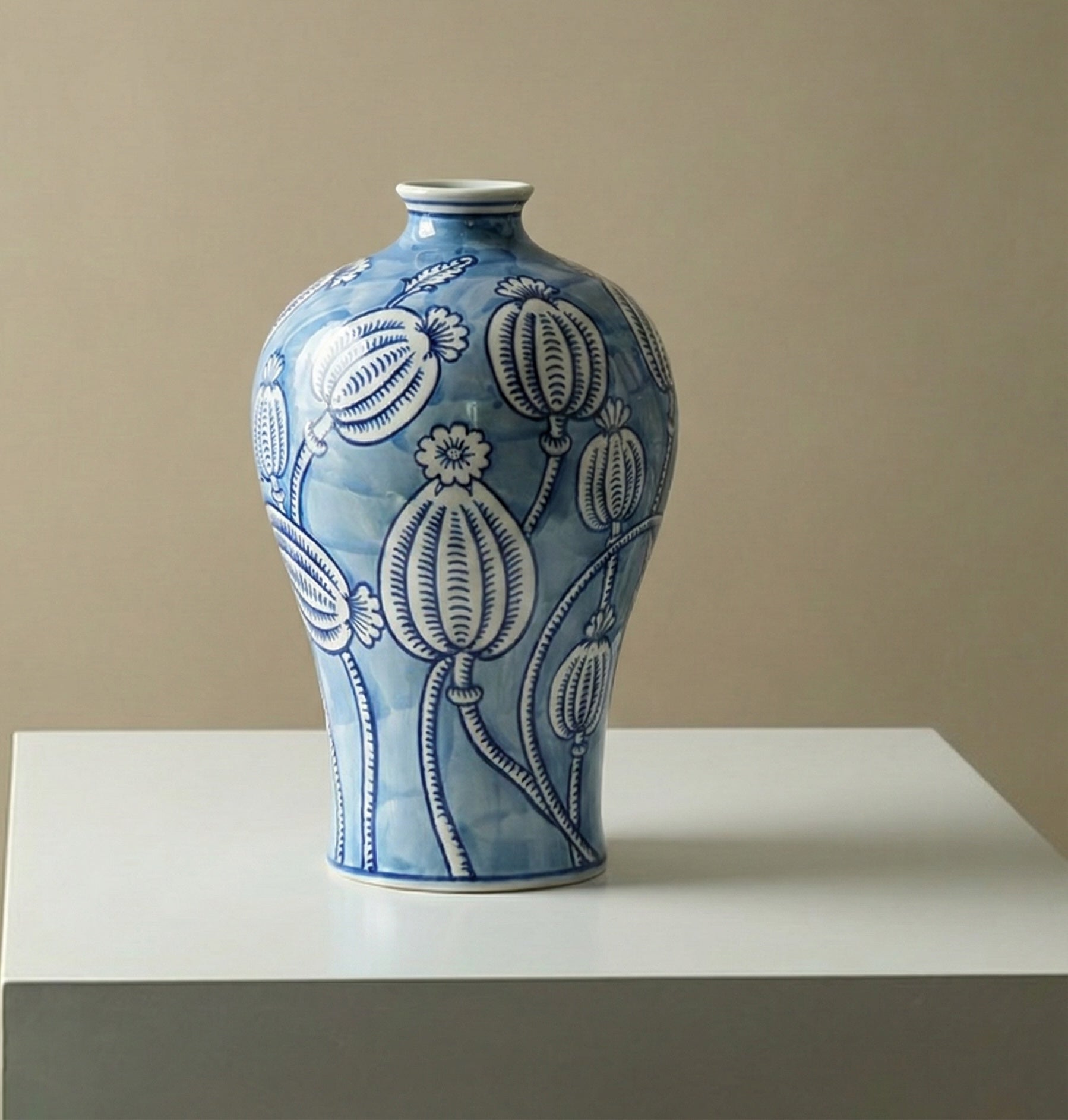 Blue and white ceramic vase with botanical pod pattern