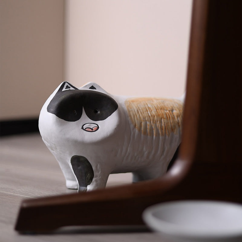 Close up of ceramic cat figurine face details