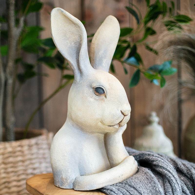 Side view of ceramic rabbit statue showing ear detail