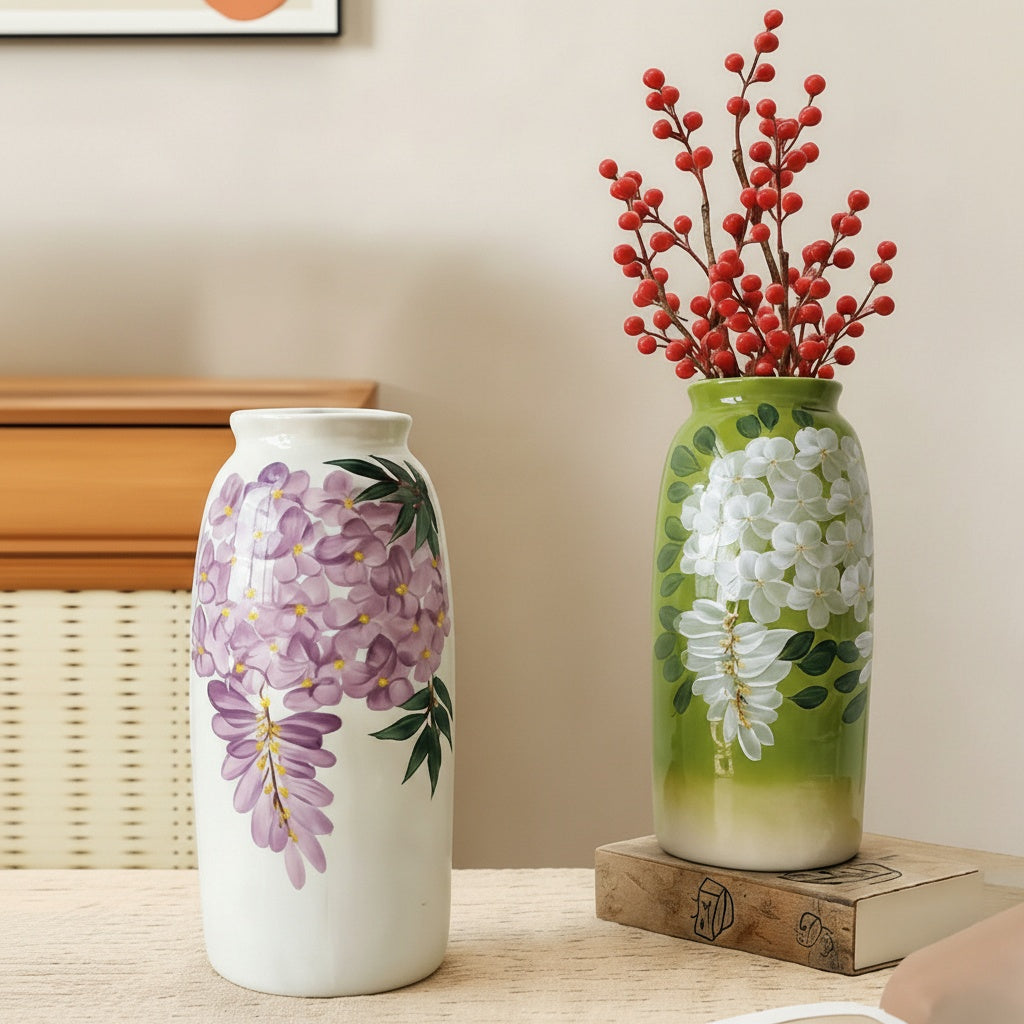 Green vase with red berries and white vase with purple flowers