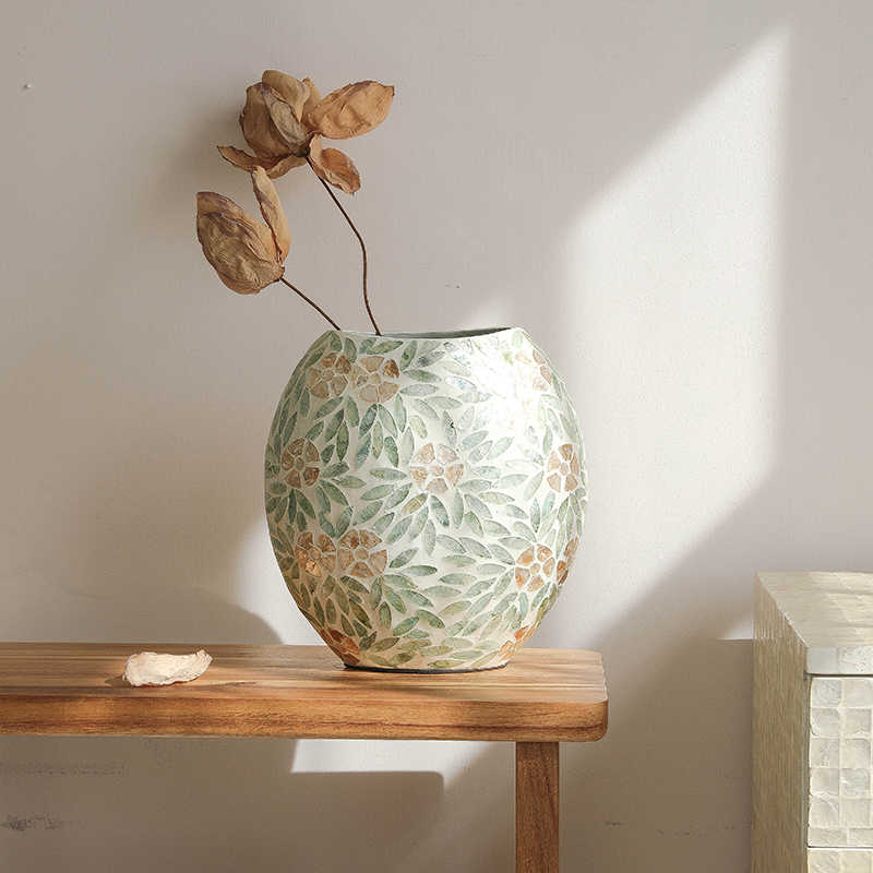 Ceramic vase with floral mosaic pattern styled with dried flowers