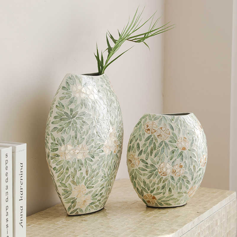 Large and medium floral mosaic vases styled on console table