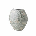 Angled view of oval ceramic vase with floral pattern