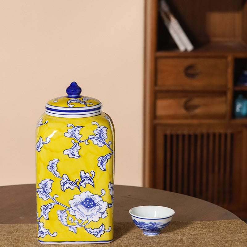 Yellow rectangular ceramic ginger jar with blue floral pattern