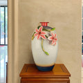 Ceramic glass vase with sculpted pink lilies on pedestal
