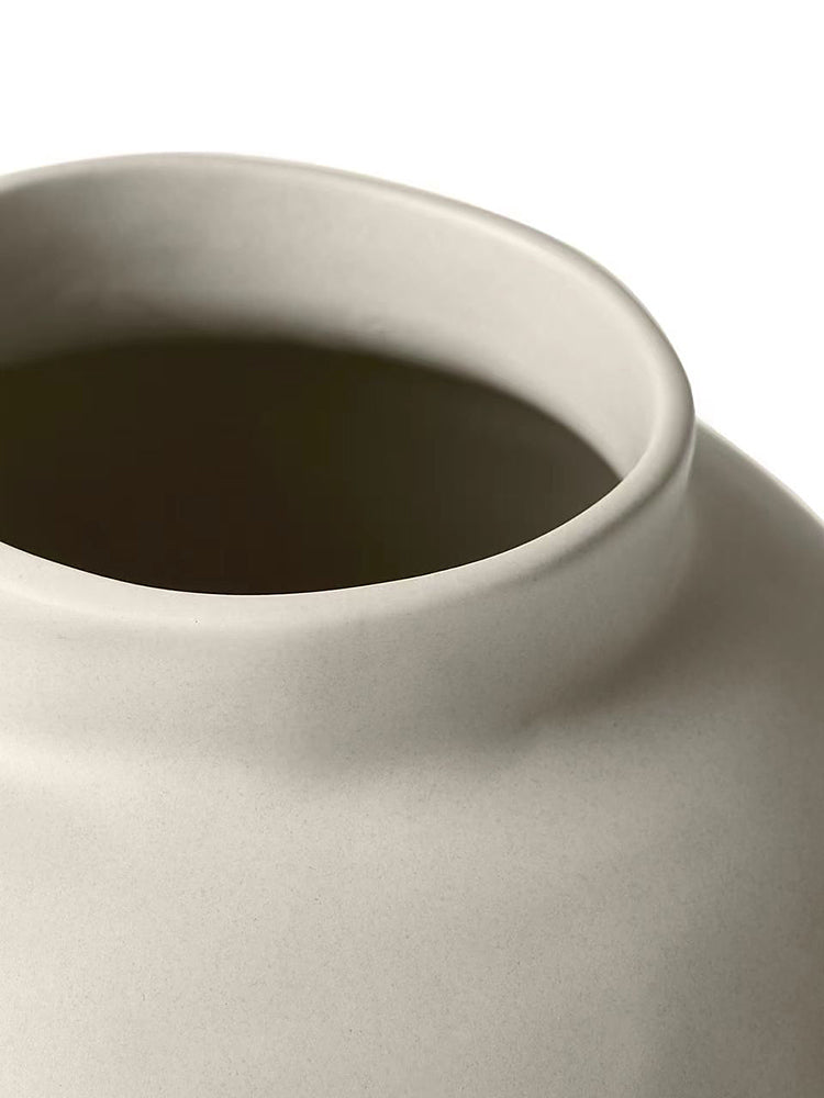 Close up detail of matte ceramic texture and vase rim