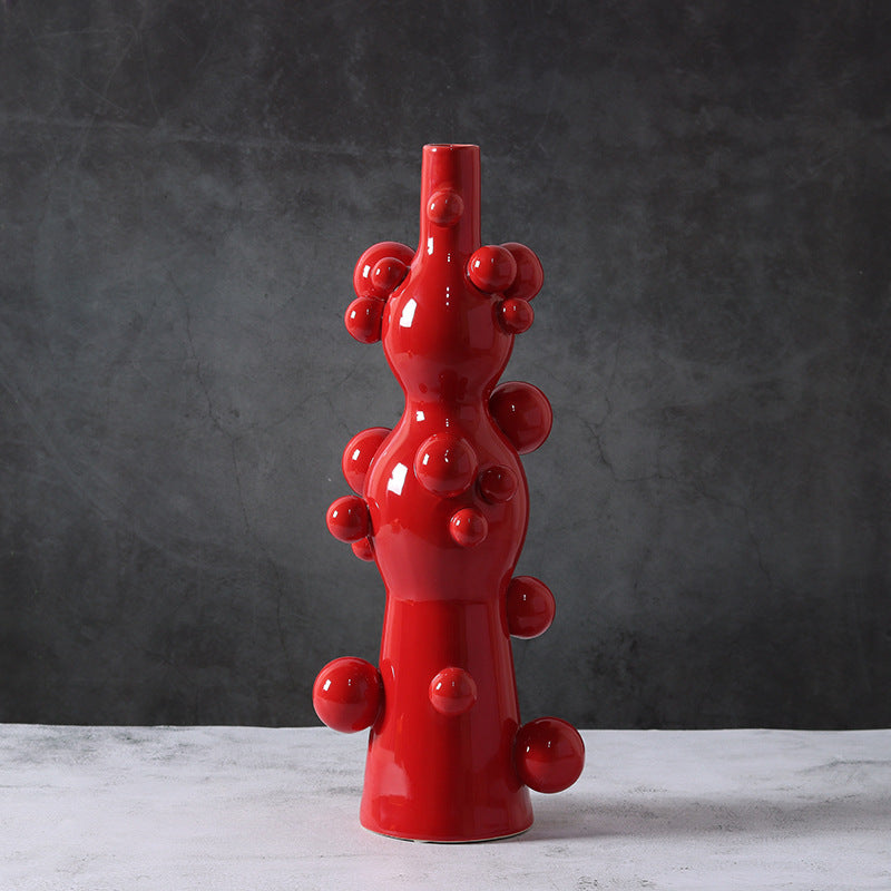 Full view of red glossy ceramic bubble vase