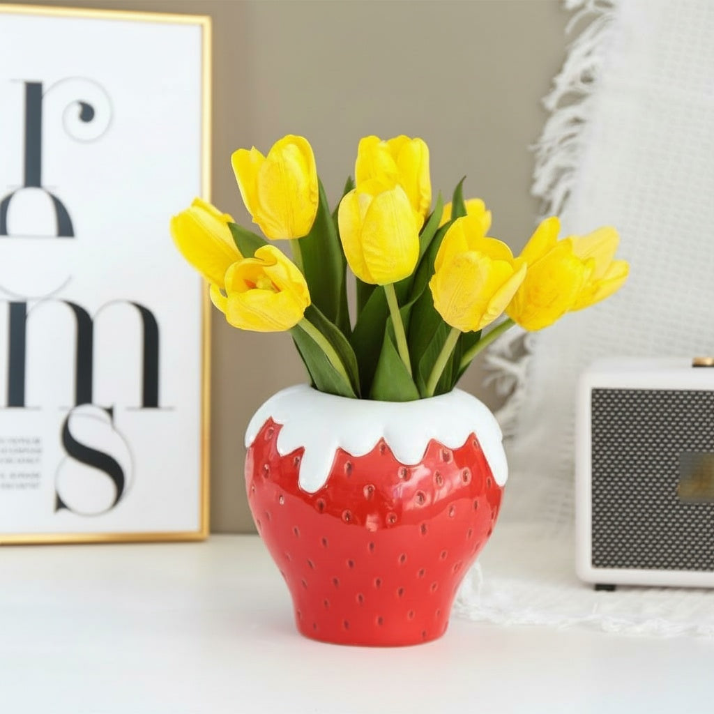 Glazed ceramic strawberry vase with yellow tulips