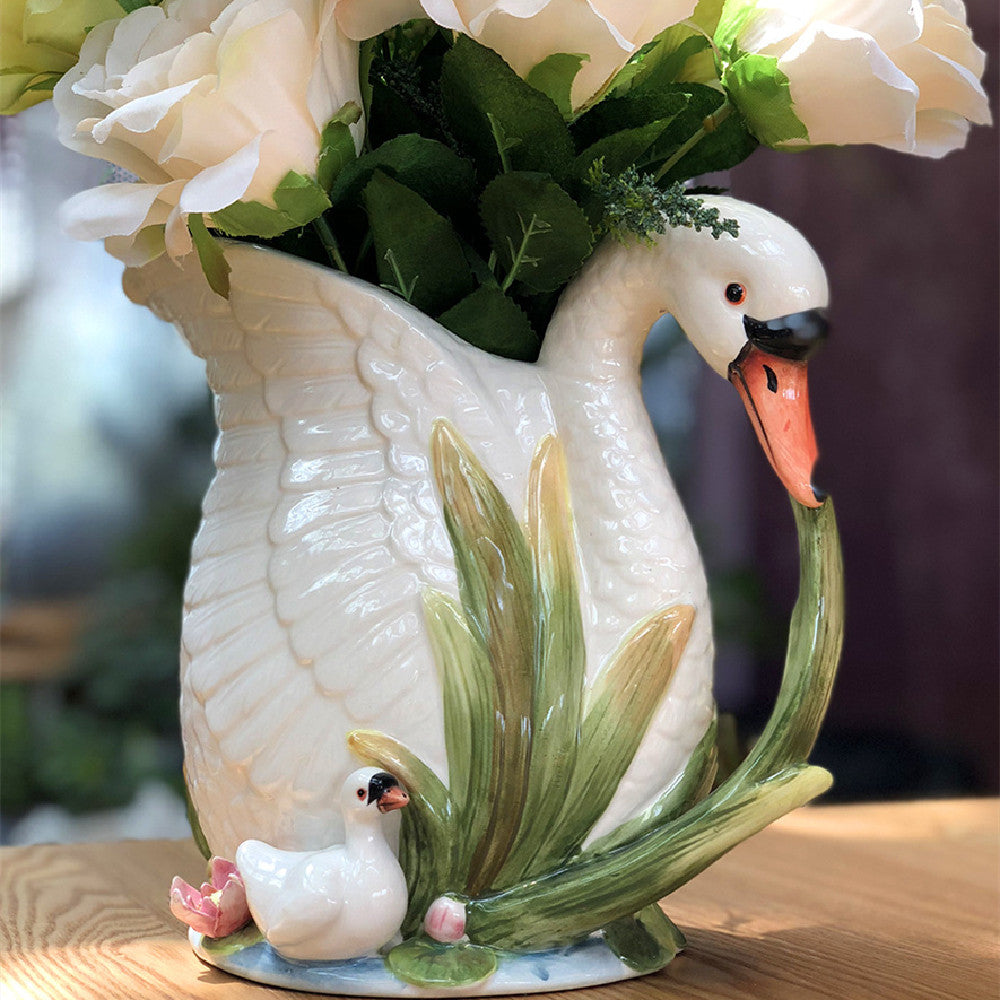 Glazed ceramic swan vase with roses