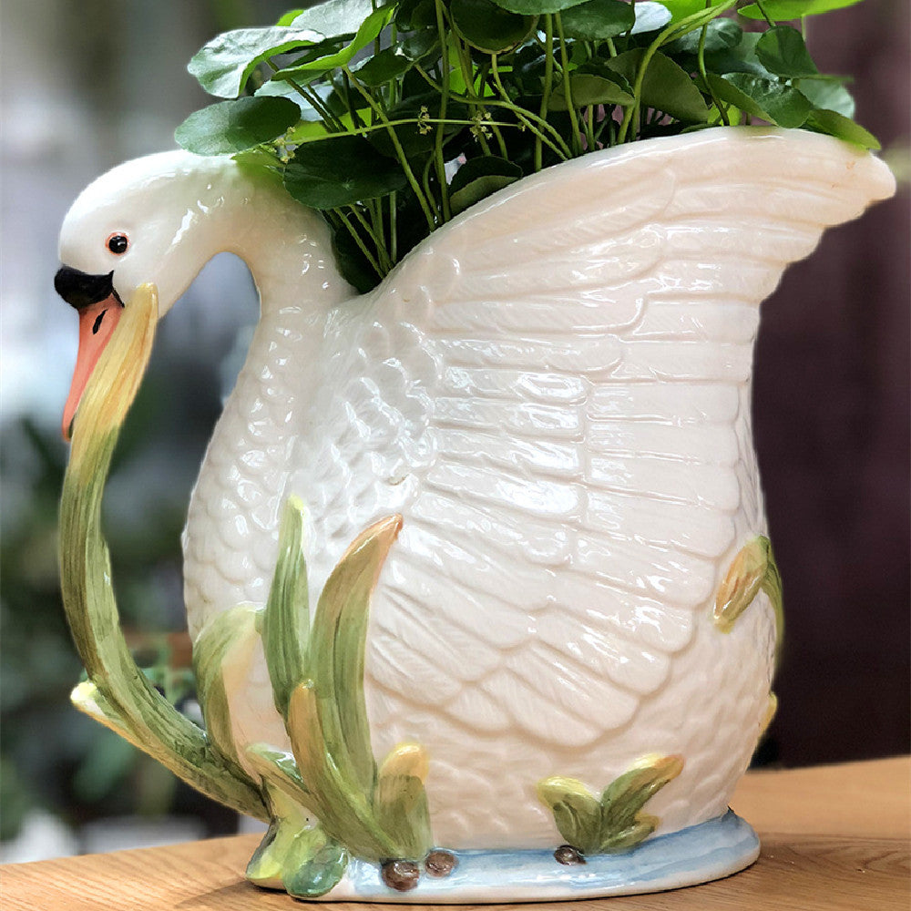 Side profile of swan vase with hand painted details