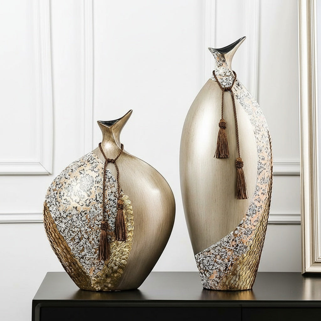 Front view of tall and round ceramic vases with tassels