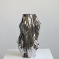 Large chrome silver ceramic twisted vase front view