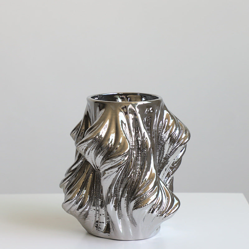 Medium chrome silver ceramic twisted vase front view