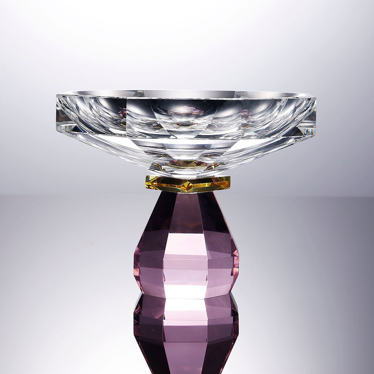 Front view of faceted clear and amethyst crystal bowl