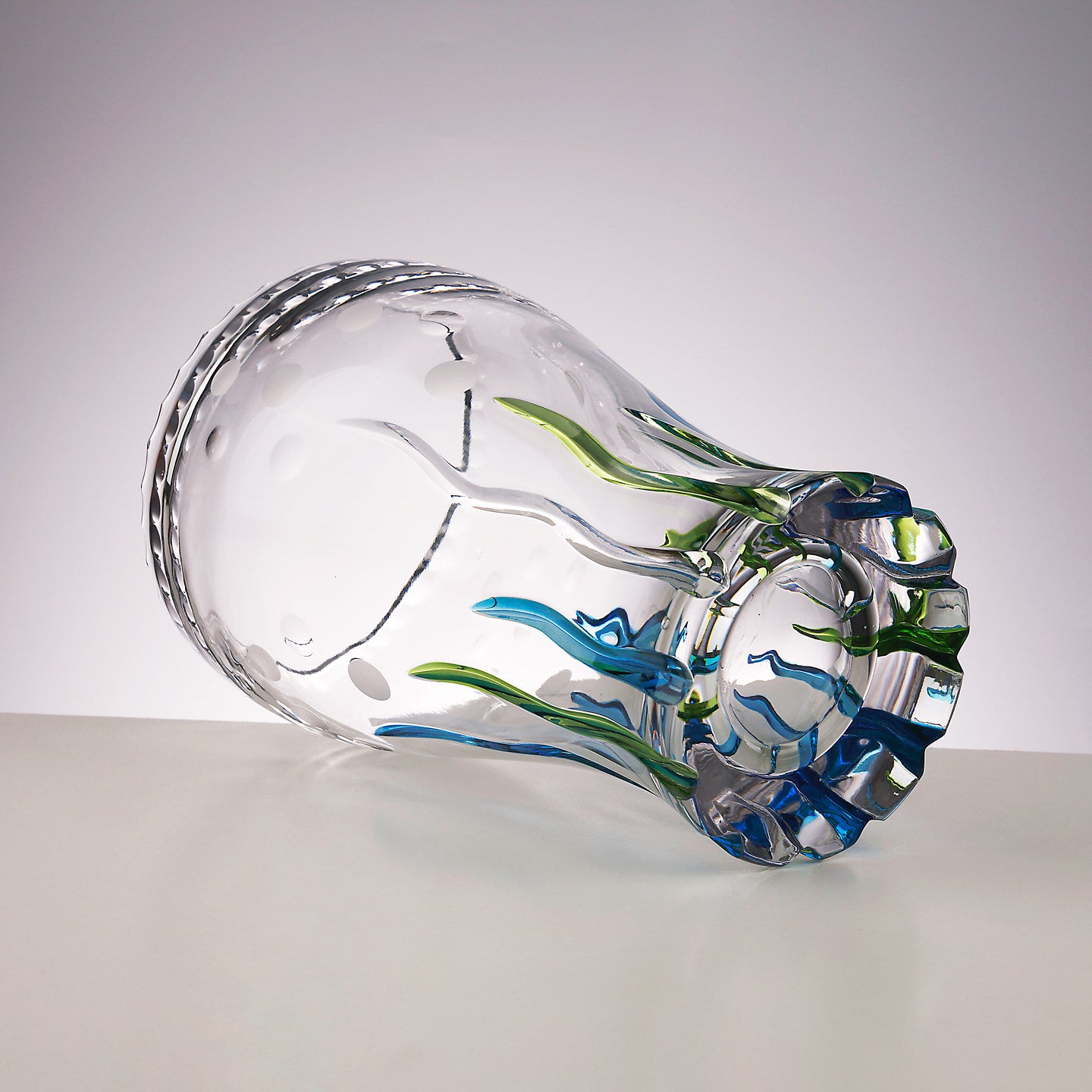 Bottom view showing thick glass base and color integration