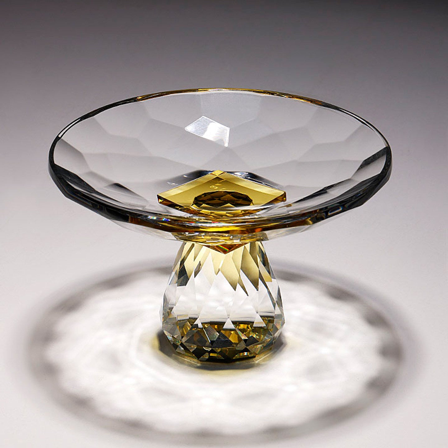 High angle view of crystal bowl showing amber geometric center